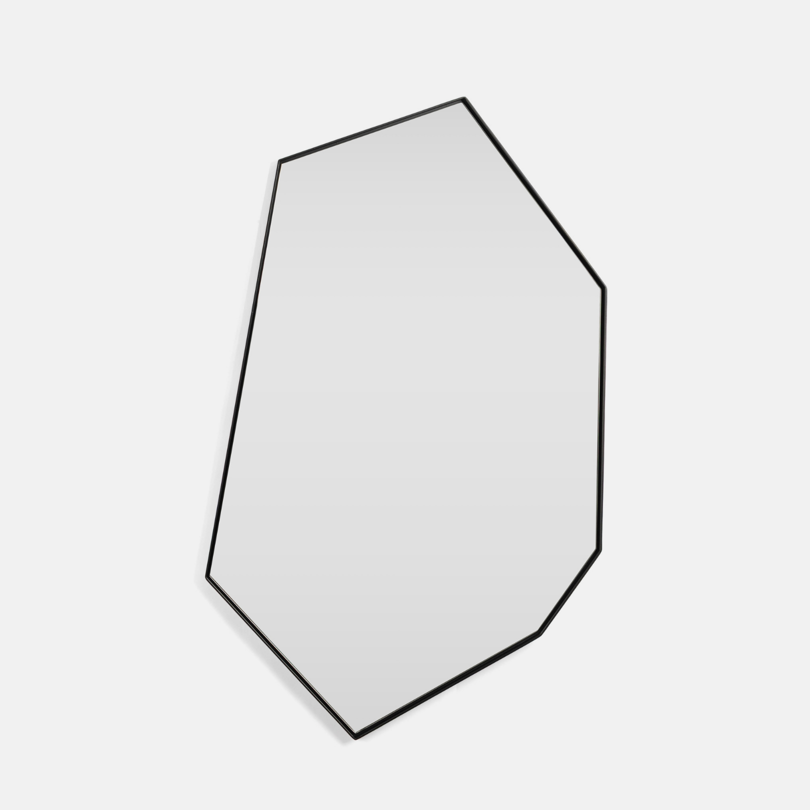 A Geometric Shaped Vanity Mirror on light grey background