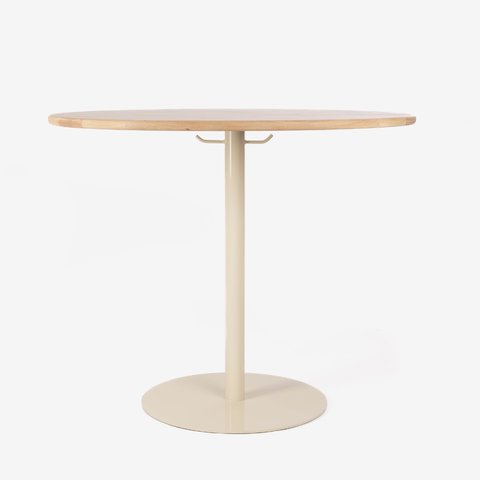 Round table with a light wood top and beige base on a white background
