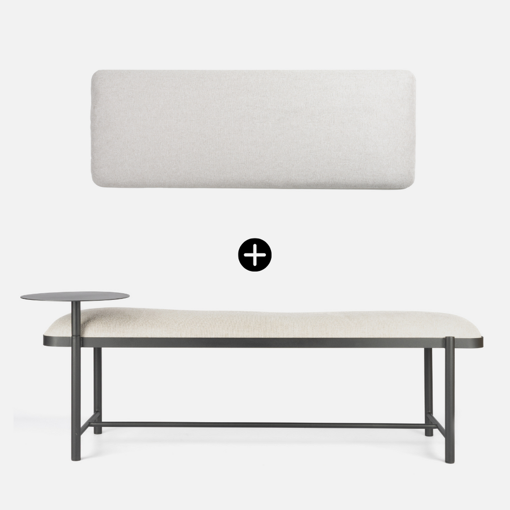 Modern bench with a white cushion and metal frame on a white background with headboard